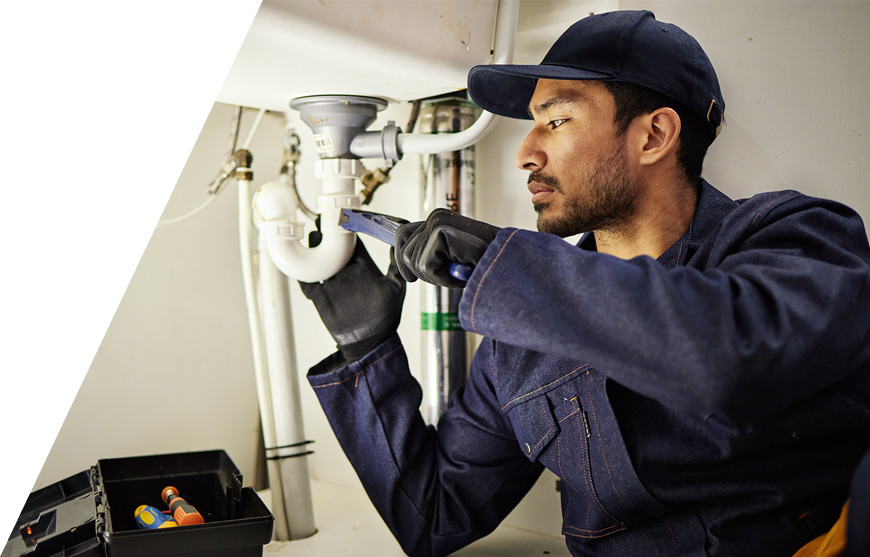 A plumber on a job scheduled with Zuper’s plumbing scheduling software