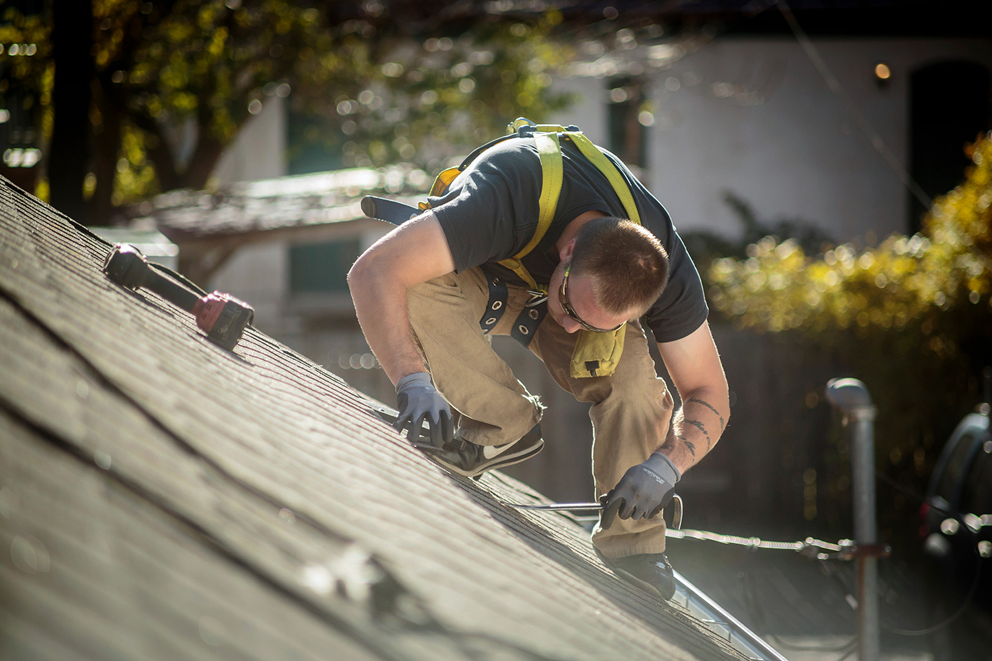 A roofing contractor on a job closed with CRM software